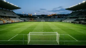 Floodlit football stadium symbolizing Jagiellonia’s four-goal lead before the Europa League return in Tbilisi