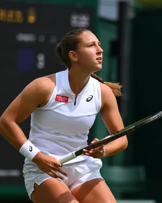 French tennis player Diane Parry in a white Asics outfit during a match
