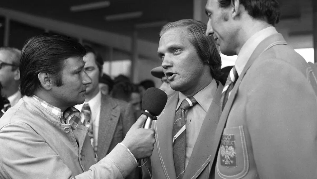 Black and white photo of Hubert Jerzy Wagner being interviewed by a reporter