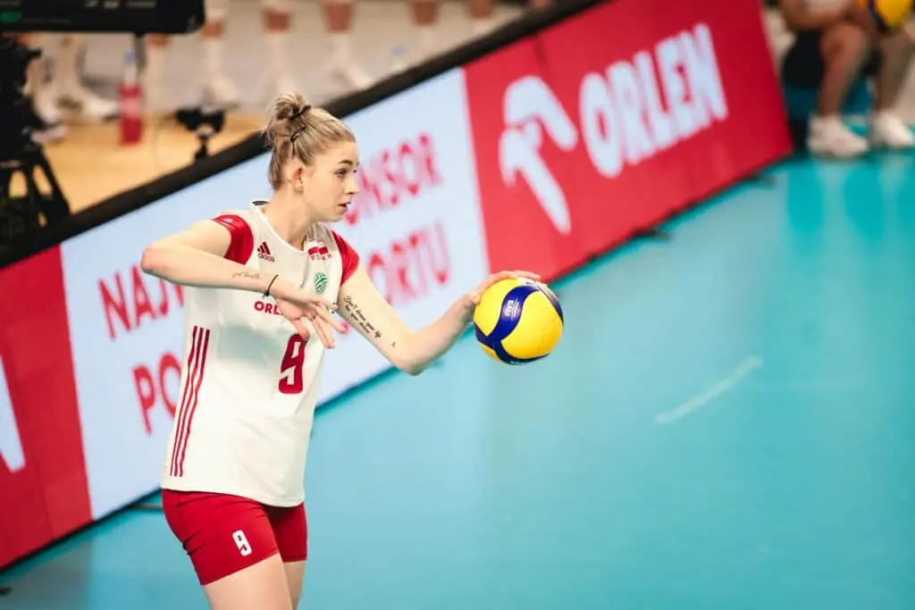 Magdalena Stysiak in the Polish national volleyball team jersey holding a volleyball