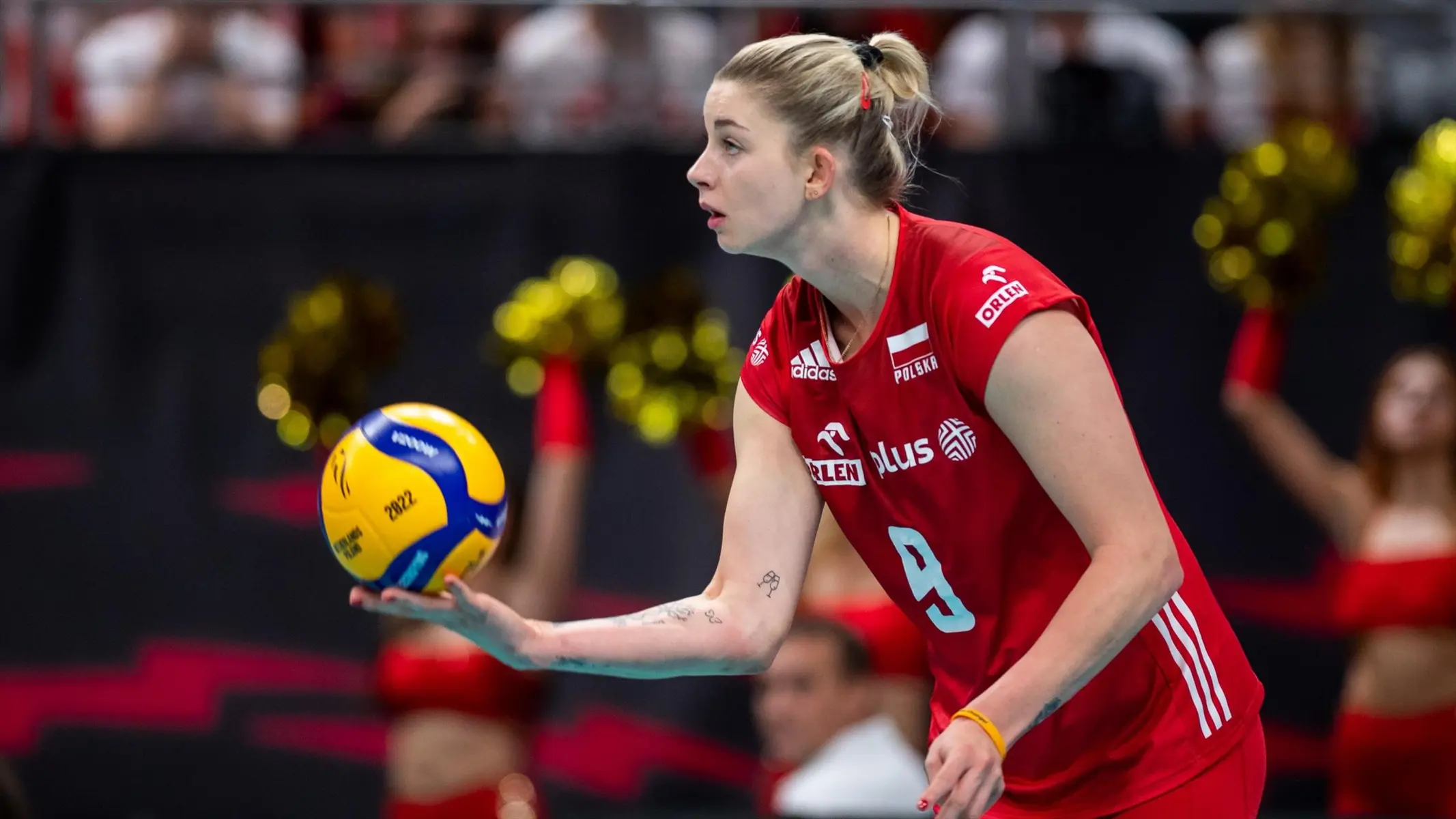 Magdalena Stysiak of the Polish national volleyball team preparing to serve during a match